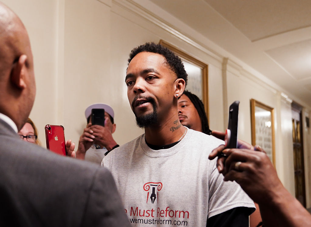 Dimetrious Woods talks to Rep. Shamed Dogan